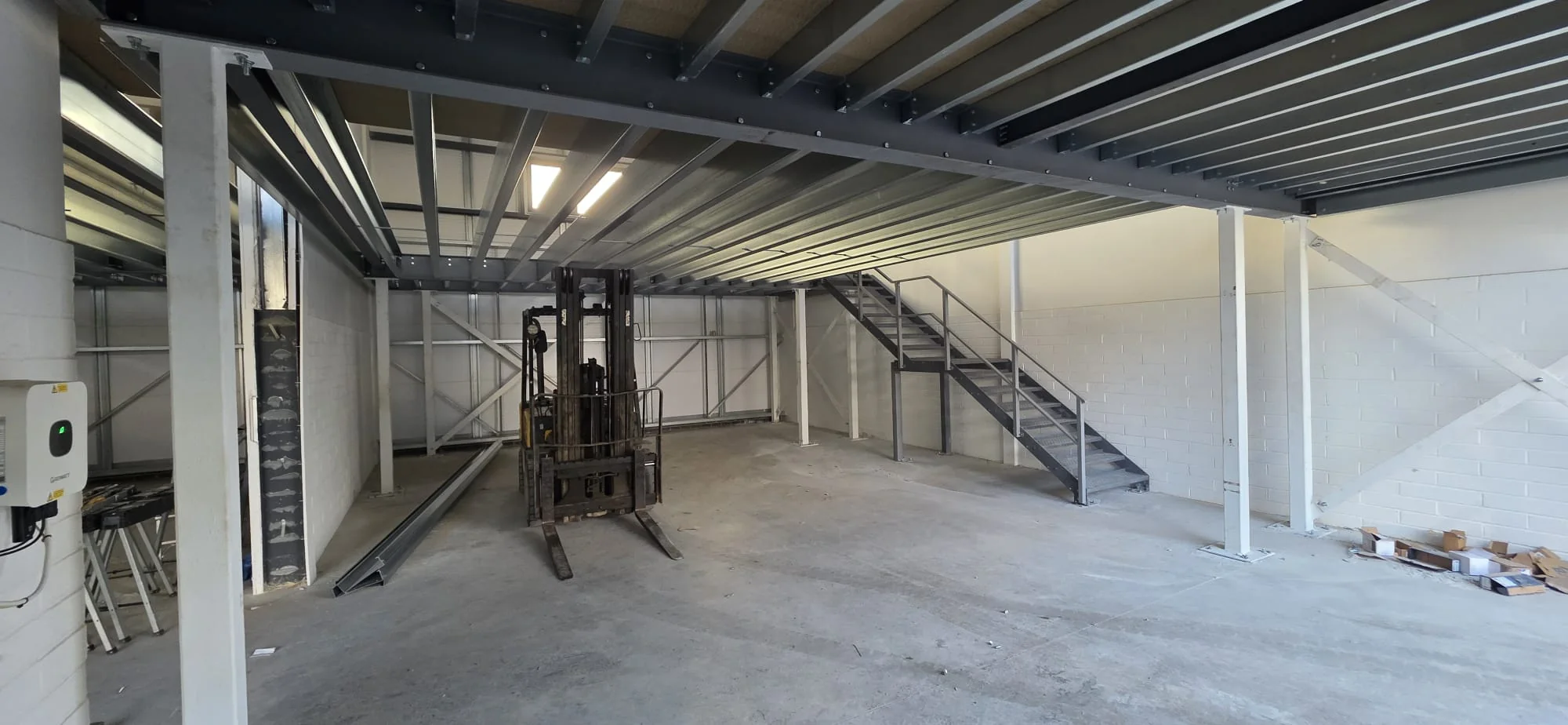 Structural steel mezzanine and staircase installation
